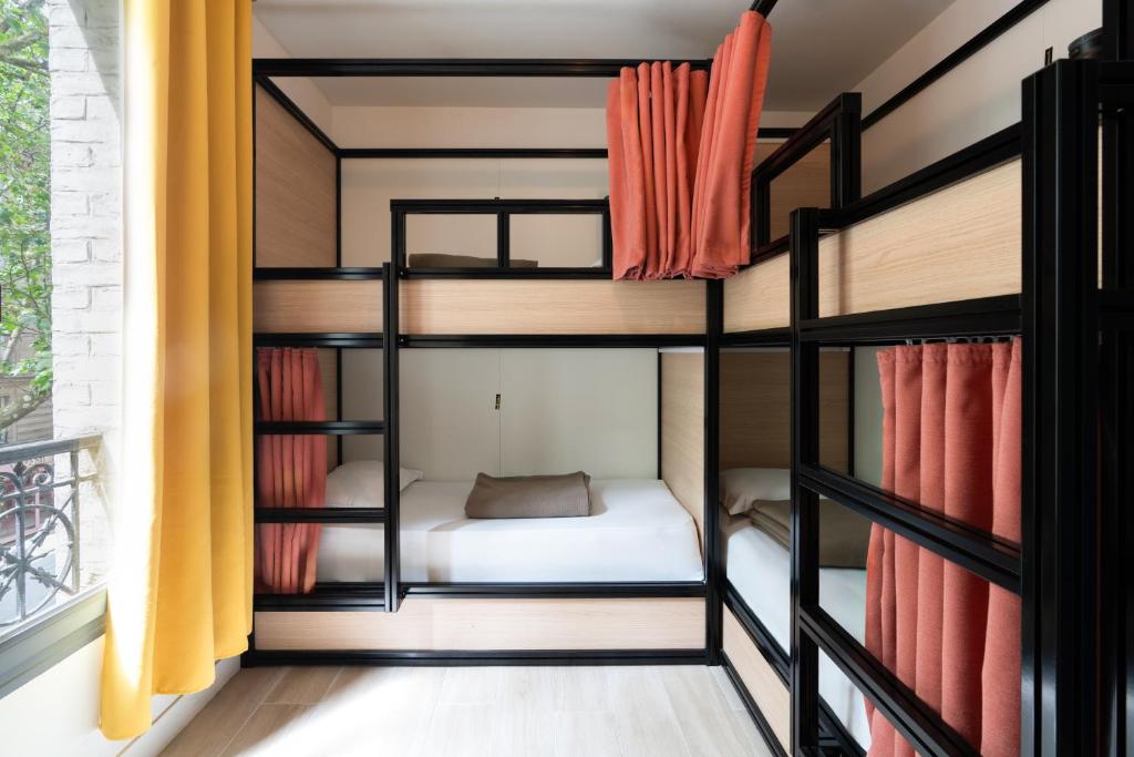 a room with bunk beds in a house at Paris Hostel in Paris