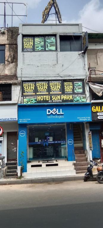 a building with a hotel sign on the side of a street at Hotel Sun Park in Ahmedabad