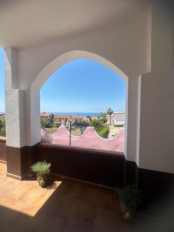 a room with a large window with a view at Villa Julieta in Scalea