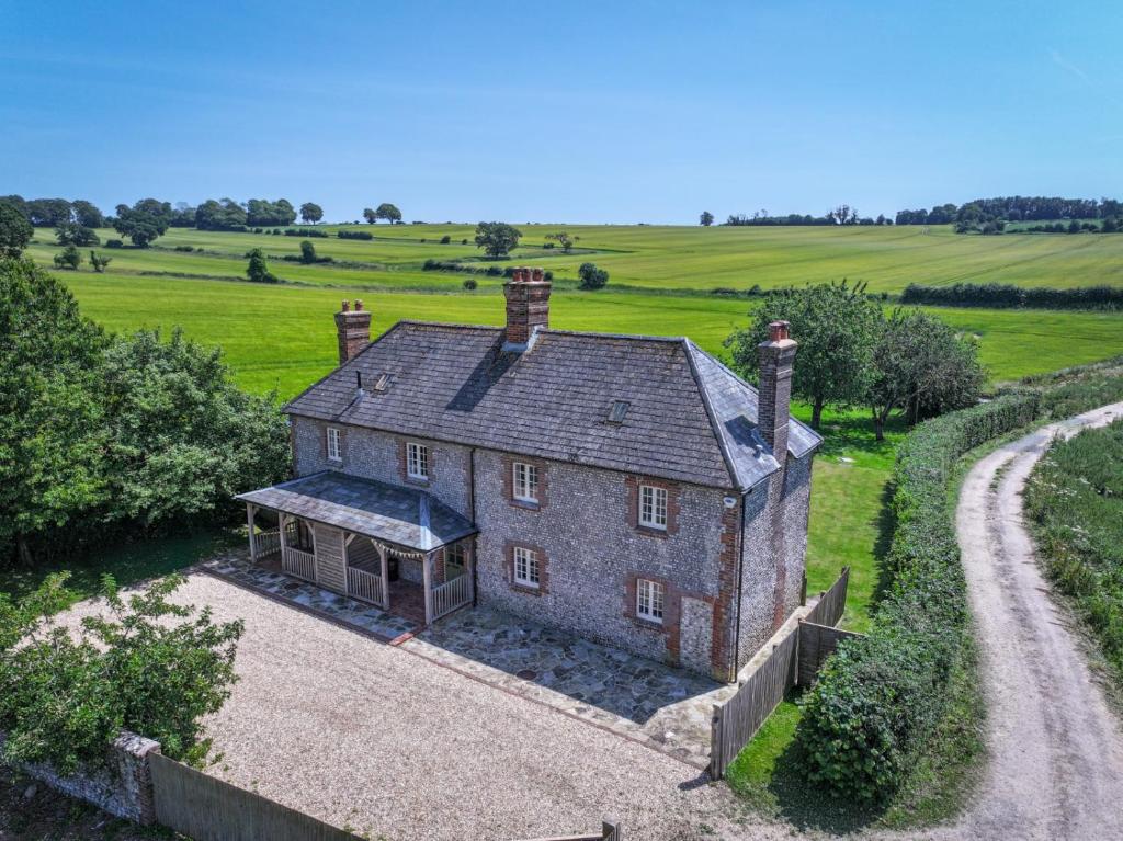 an aerial view of a house in a field at Lower Colworth Lodge in Chichester