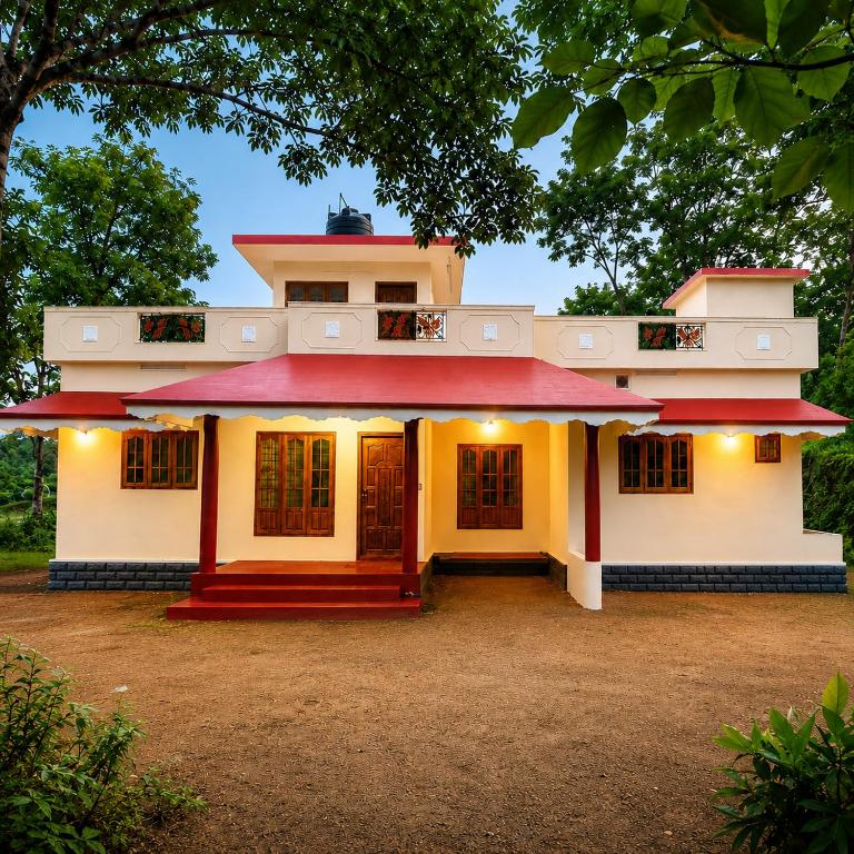 a house with a red roof at Canorix Inn in Athirappilly
