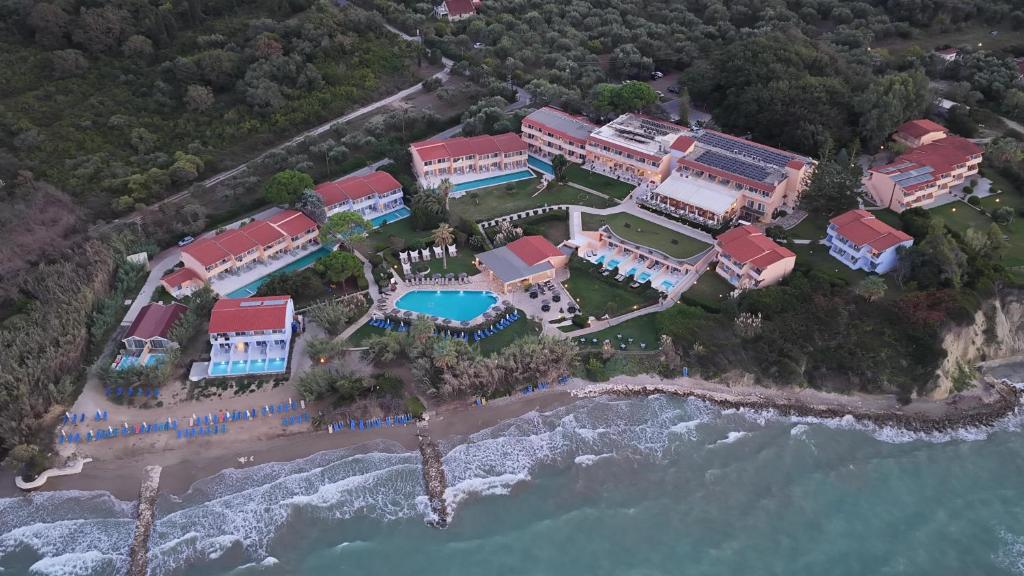 an aerial view of a resort next to the ocean at Ibiscus Corfu Hotel in Roda