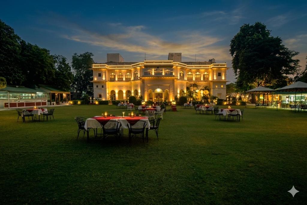 a large building with tables and chairs in front of it at Hari Mahal Palace by Pachar Group in Jaipur