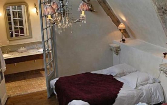 Postel nebo postele na pokoji v ubytování Manoir de la Villeneuve