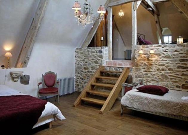 Postel nebo postele na pokoji v ubytování Manoir de la Villeneuve