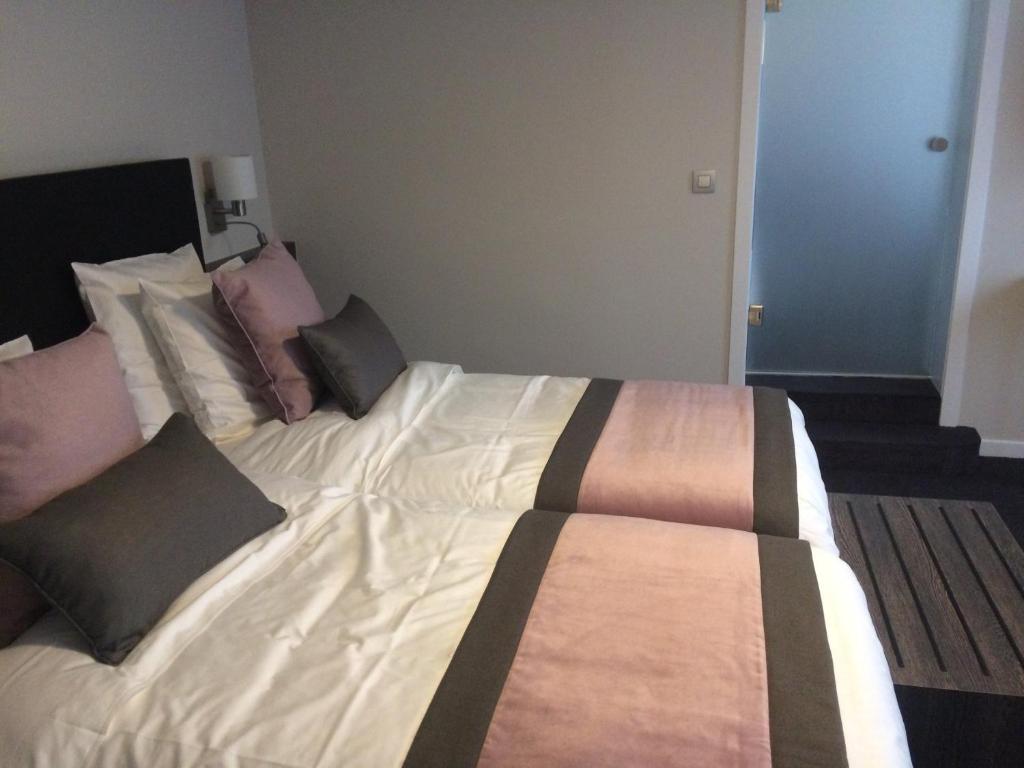 Postel nebo postele na pokoji v ubytování Hotel Du Moulin
