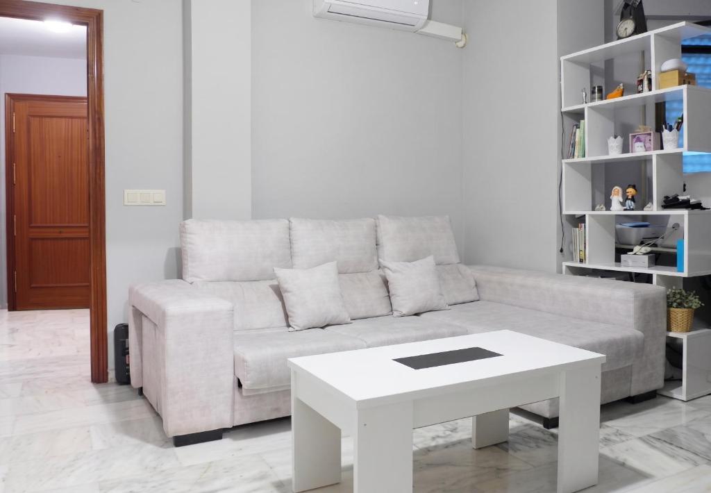 a living room with a couch and a table at Comfortable Apartment in Almuñécar in Almuñécar