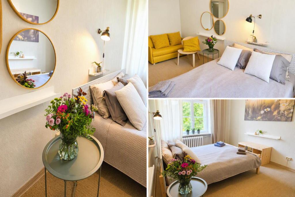 a room with a bed and a couch and a mirror at Pasta Kvartāls Inn in Ogre