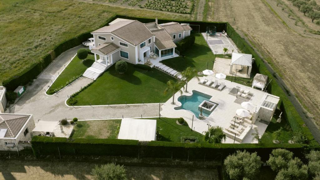 an overhead view of a large house with a pool at Villa Shangri-La Zakinthos in Zakynthos