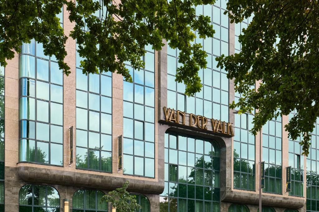 a building with a sign on the front of it at Van der Valk Hotel Park Lane Antwerpen in Antwerp