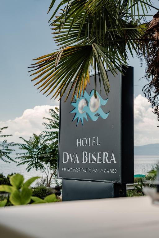 a sign for a hotel dvva bicheno at Hotel Dva Bisera in Ohrid