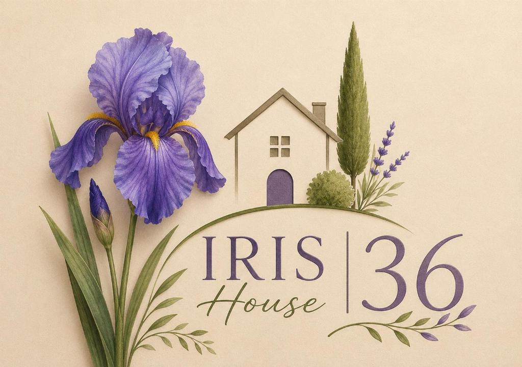 a sign with a house and flowers on a wall at Casa Iris in Montepulciano