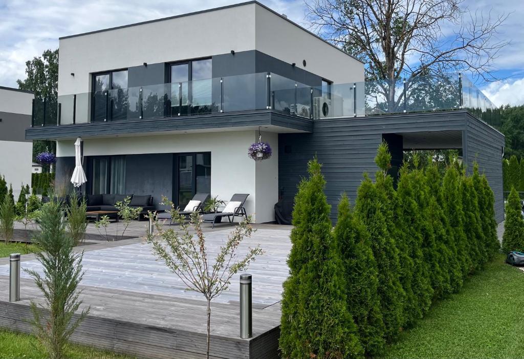 a large white house with a lot of windows at Kvissentali House in Tartu
