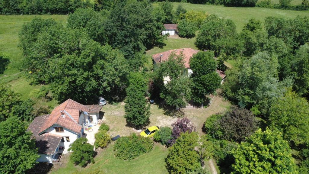 an aerial view of a house with trees at Mondeslandhaus in Courrensan