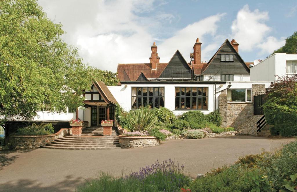 a large white house with a black roof at Best Western The Webbington Hotel & Spa in Loxton