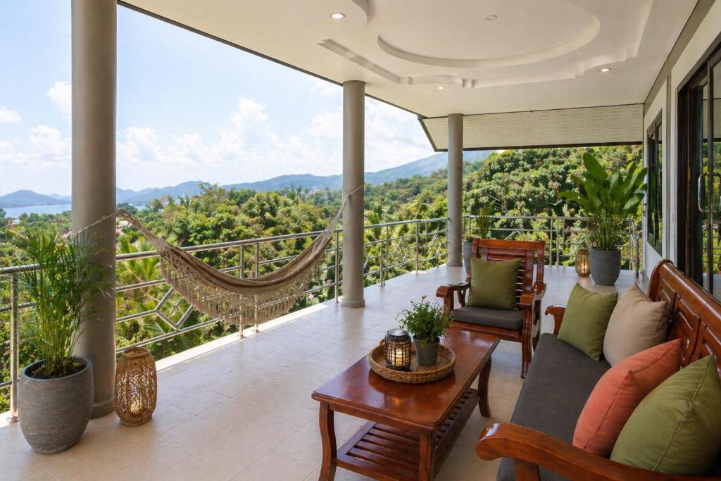 a living room with a hammock on a balcony at Villa Archie INCREDIBLE Sea View second fl in Ko Phangan