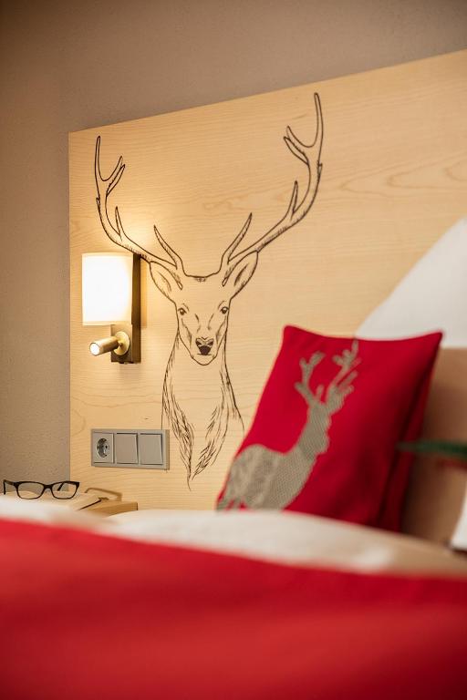 Postel nebo postele na pokoji v ubytování Hotel Wiedemann