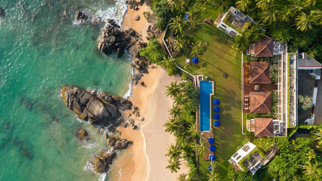 an aerial view of the beach and ocean at Kumu Beach By Teardrop Hotels in Balapitiya