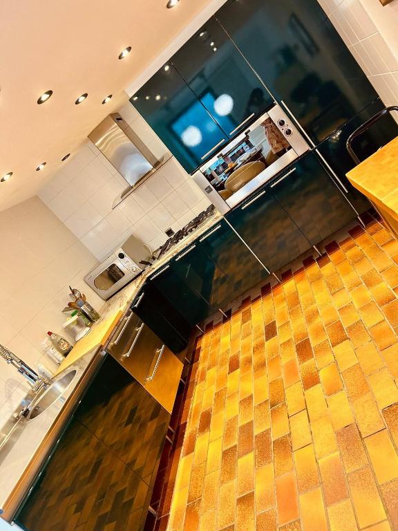 an overhead view of a kitchen with a counter at Private room with shared bathroom in Clavier