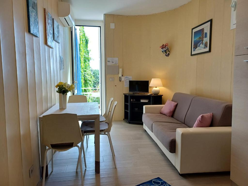 a living room with a couch and a table at Total Relax Home by Holiday World in Framura