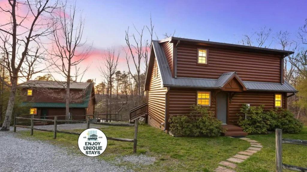 a log cabin with a sign in front of it at Mountain Hideaway at Cabins in the Clouds in Rising Fawn