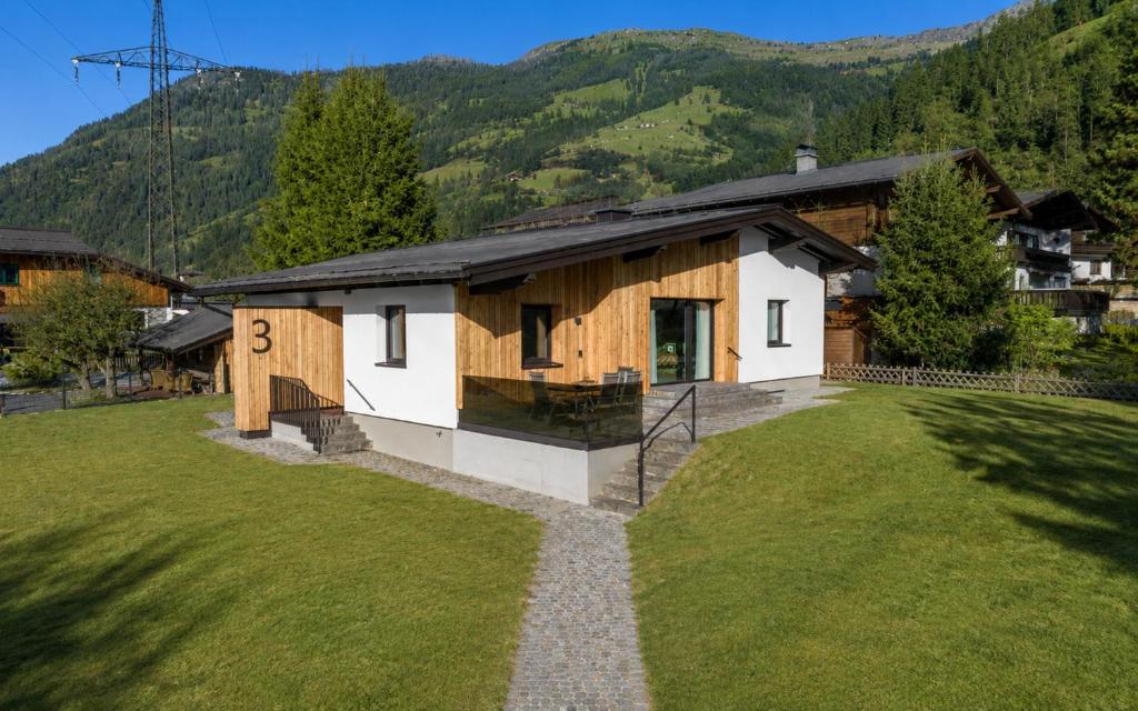 a house in the middle of a large yard at Dorfchalet by we rent in Dorfgastein