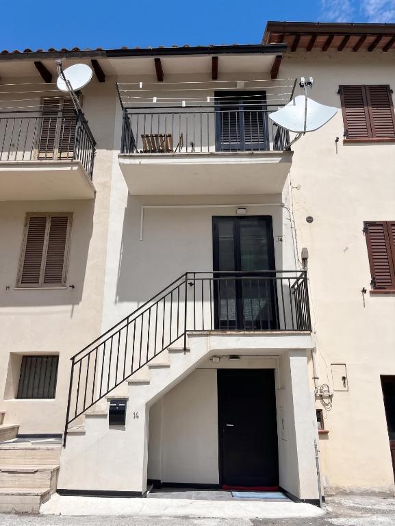 a white building with a staircase and a door at House with Private Pool in Spindoli - 100 m² in Spindoli