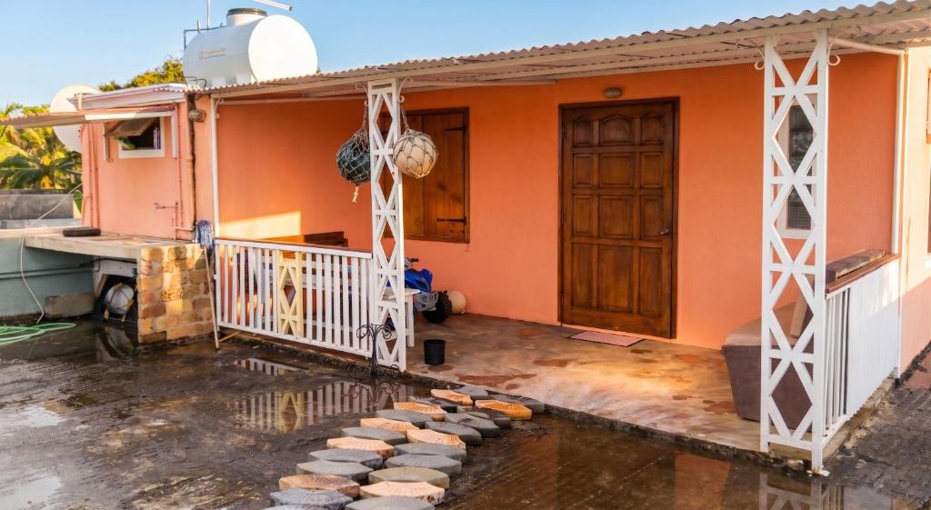 a house with a front porch with stepping stones at Charming studio with sea-view terrace in Souillac - 22 m². in Souillac