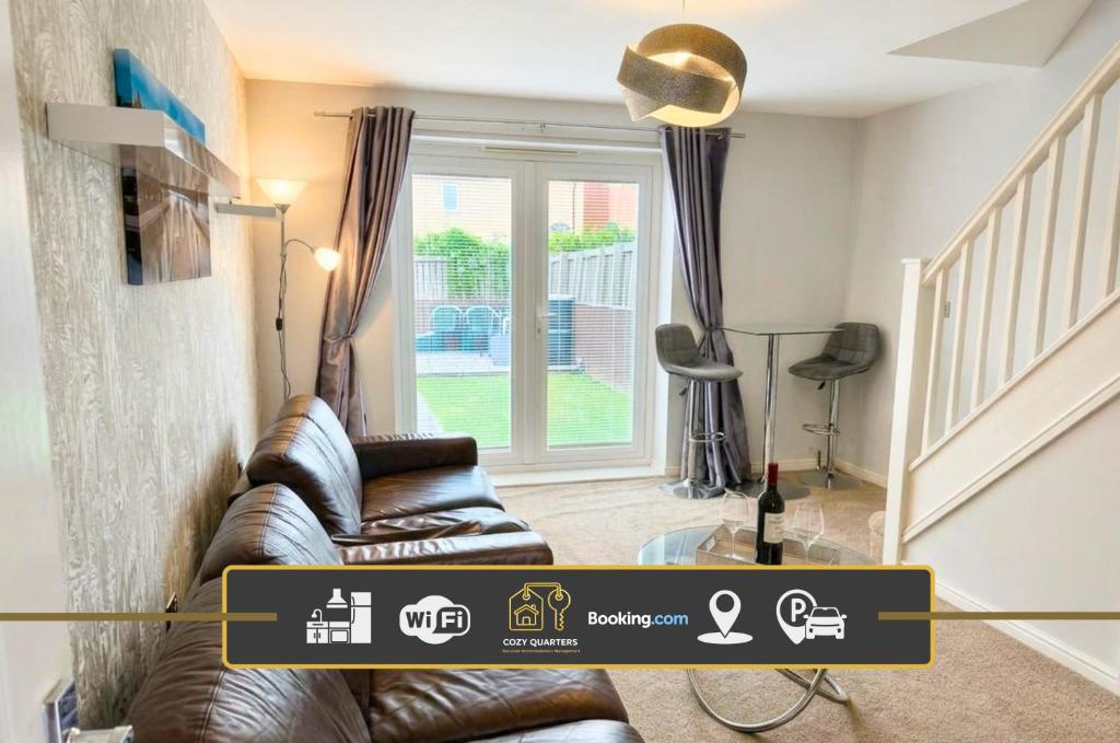 a living room with a leather couch and a window at 2BR House By Cozy Quarters Property Management Contractors Accommodation Spennymoor With Parking in Spennymoor