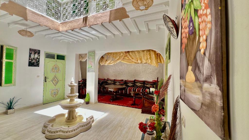 a living room with a couch in the background at Riad Dar Lokman in Marrakesh