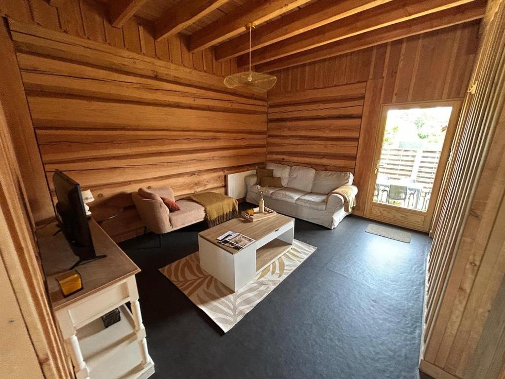 an overhead view of a living room in a log cabin at Golden Nest in Courteranges