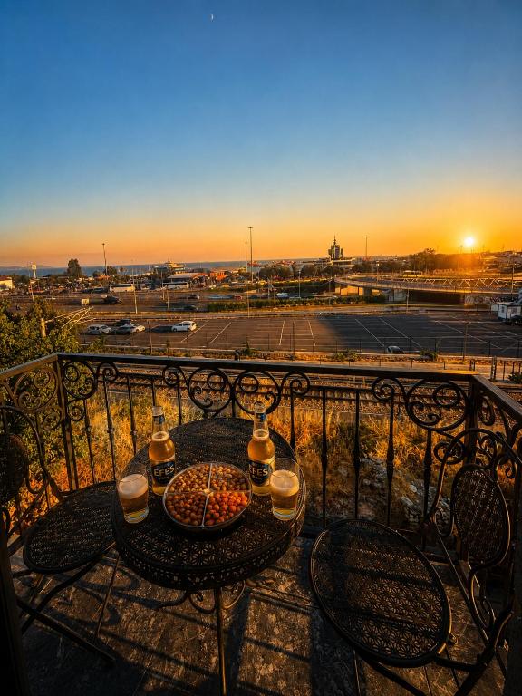 a table on a balcony with a view of a parking lot at Kumkapı Hotel - Special Category in Istanbul