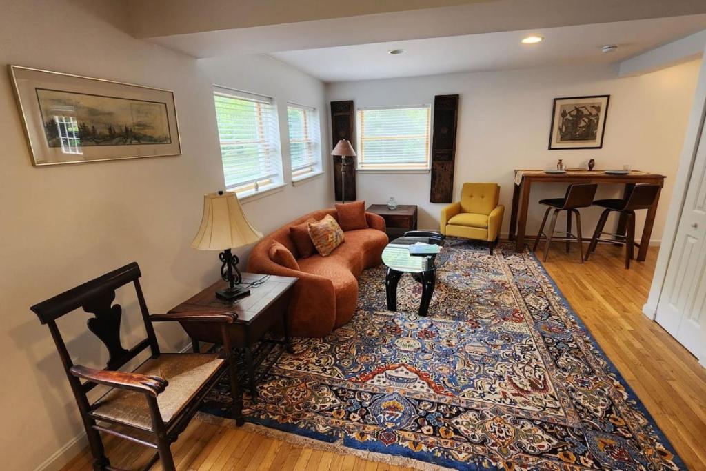 a living room with a couch and a table at Shelburne Falls on Main in Shelburne