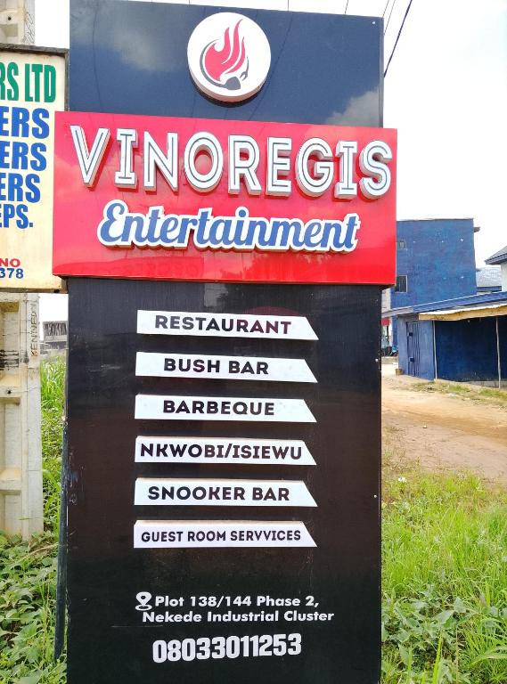 a sign for a vincennes entertainment istg istg at Vinoregis Entertainment Lounge in Owerri