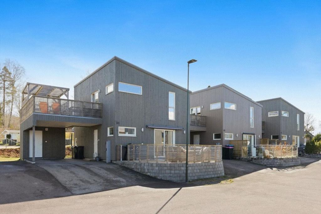 a large building with two story at Three bedrooms house in Holmestrand