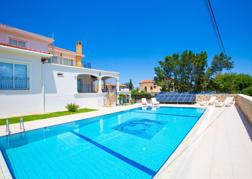 a swimming pool in the backyard of a villa at Villa Tiara by HolidayKeys in Kyrenia