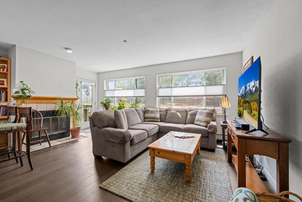 a living room with a couch and a table at Flatirons Hideaway in Boulder CO in Boulder