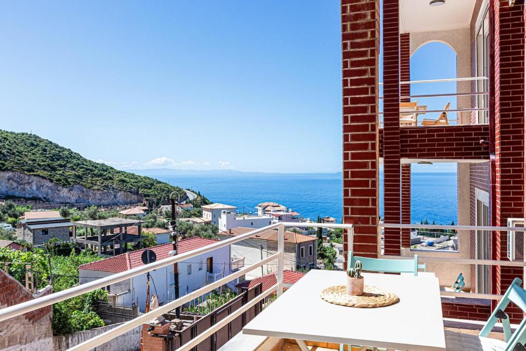 a balcony with a view of the ocean at Dhermi's Icon Big 1BR Apt 6 in Dhërmi