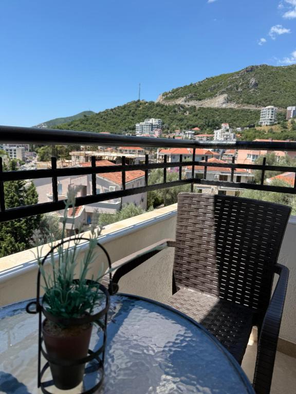 a table and chairs on a balcony with a view at Power view in Bečići