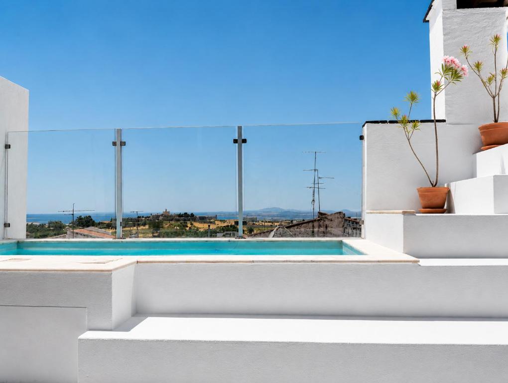 a view of a pool from a house at CASA d’OLIVENÇA in Elvas