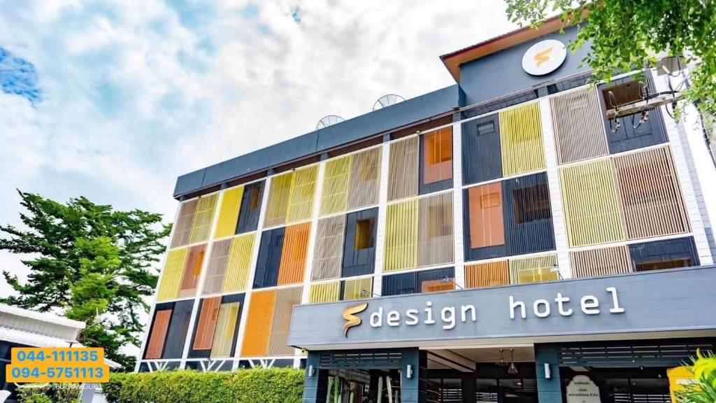 a hotel with a building with colorful windows at The S Design Hotel in Buriram