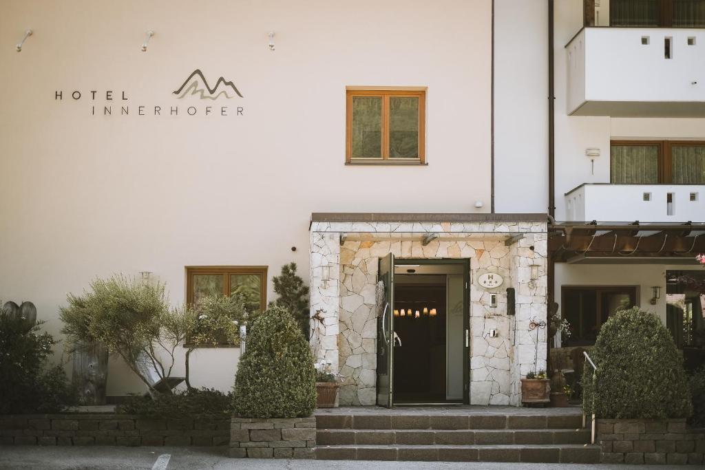 a entrance to a hotel with a black door at Hotel Innerhofer in Gais