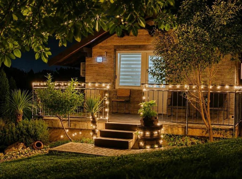 a house with lights on the front yard at Holiday home Damian in Zagreb