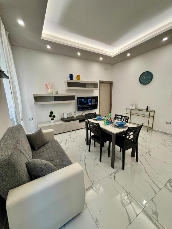 a living room with a couch and a table at Silviaapartment in Battipaglia