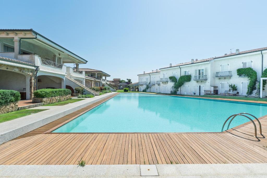 a swimming pool in the middle of a building at Residence il Gabbiano in Palau