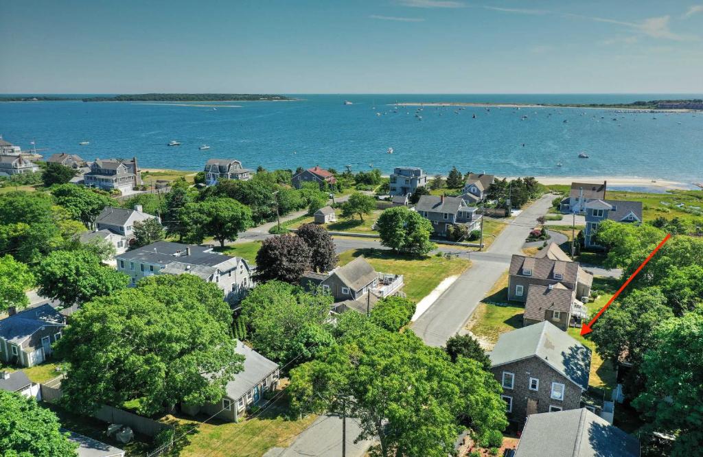 an aerial view of a neighborhood with houses and the water at Steps to the Beach Cozy Central AC in Yarmouth