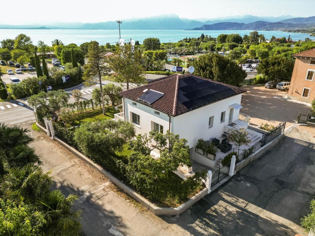 an aerial view of a white house with a roof at Corte Fossalta - Casa Linda in Lazise