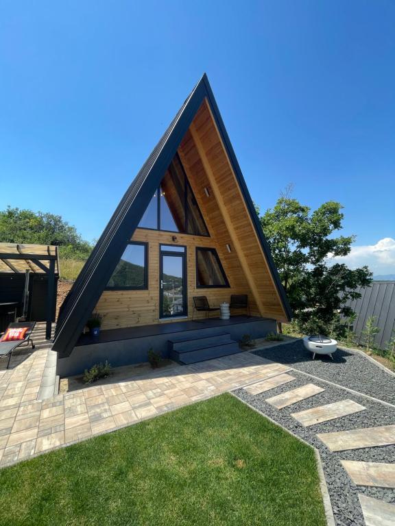 a tiny house with a triangular roof at A Frame 2 Transalpina in Sebeş