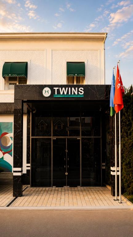 a view of the entrance to a tivins building at Guest house TWINS in Tashkent