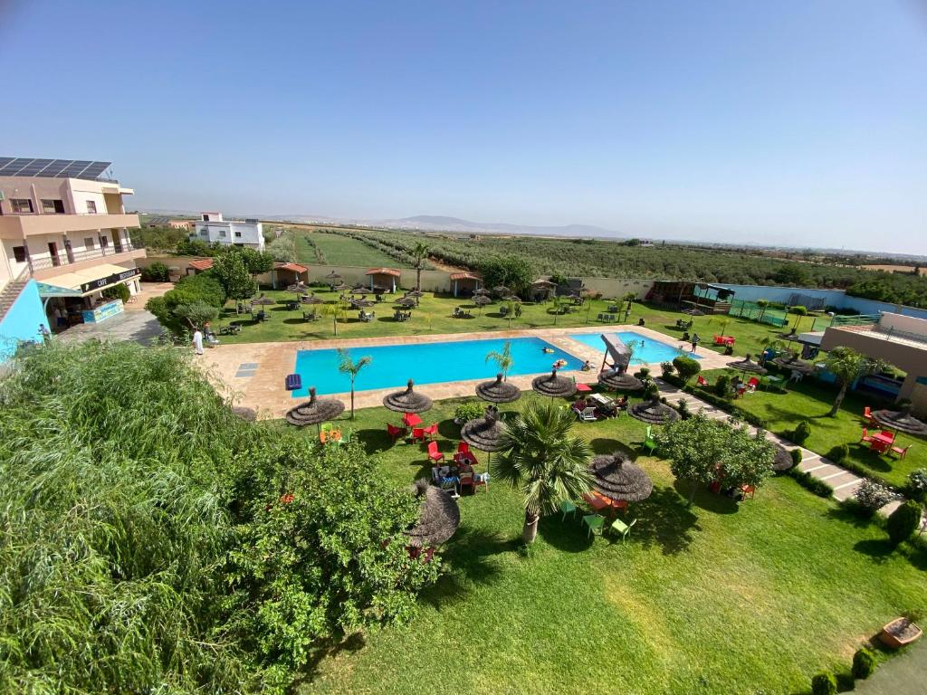 an aerial view of a resort with a swimming pool at La ferme labyed in Fez